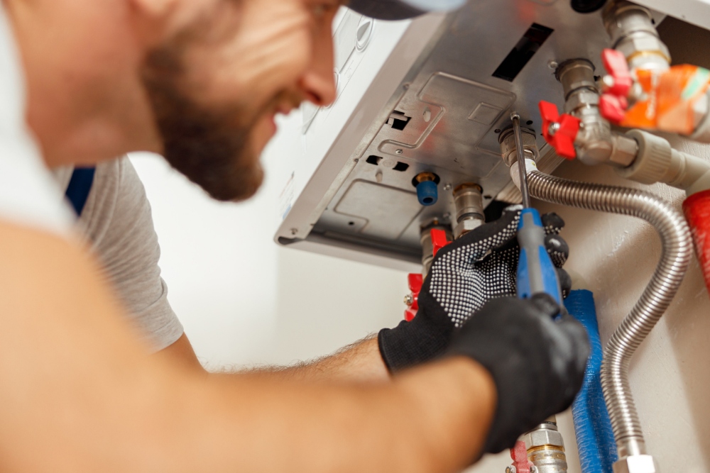 Pinnacle Plumbing & Heating at work on a boiler in a Hampshire home